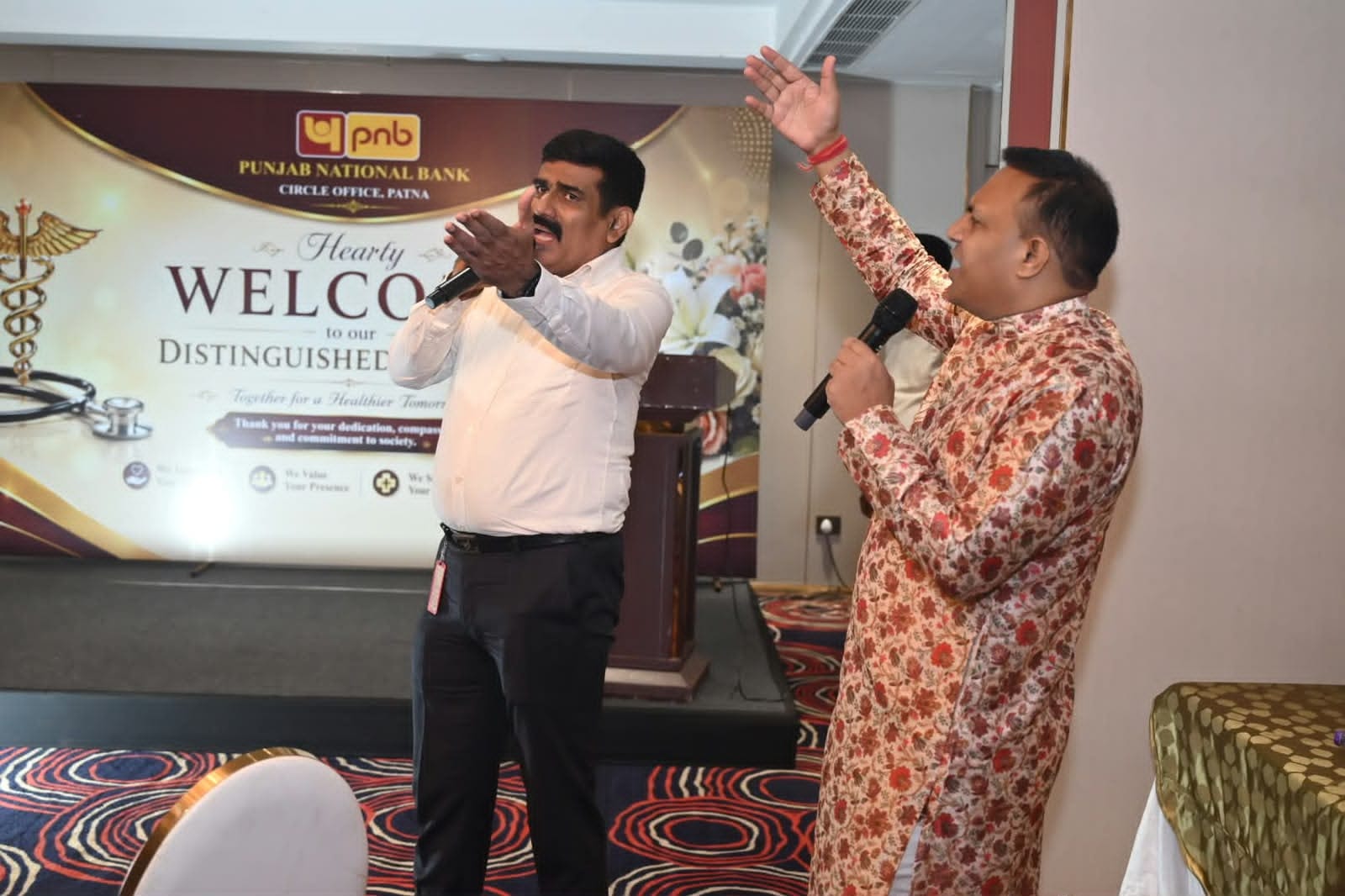 Two event hosts presenting together